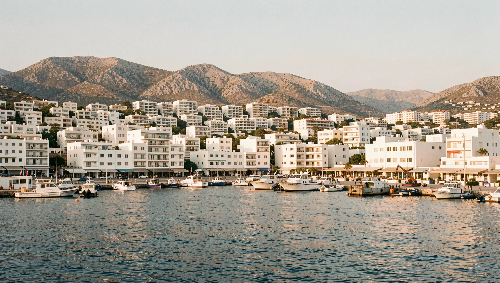 Piraeus, Greece, seen from the water at golden hour